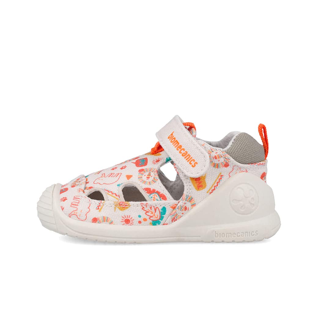 Children's white sandal with colorful print (sun, animals) and orange accents; features a Velcro strap labeled 'biomecanics' for easy fastening.